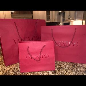 Trio of red Valentino bags